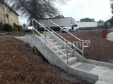 Steel tube handrails for concrete stairs in residential area